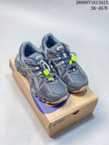 Pair of grey ASICS Gel-Kahana 8 FL sneakers with navy and lime accents, shown on a shoebox