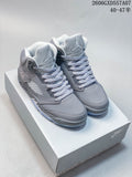 Gray Jordan Air Jordan 5 high-top sneakers on a shoe box