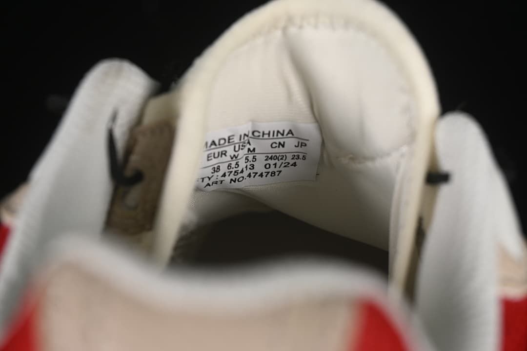 Close-up of the shoe tongue size label showing EU 38
