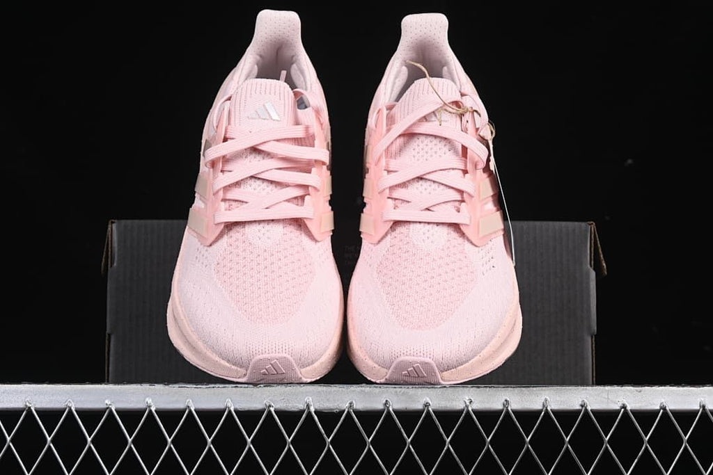 Front view of the pair of pink running shoes