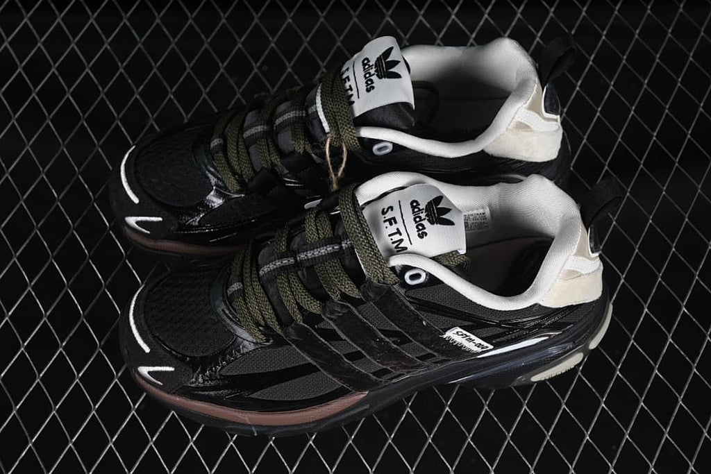 Pair of black Adistar Cushion SFTM sneakers shown from above.