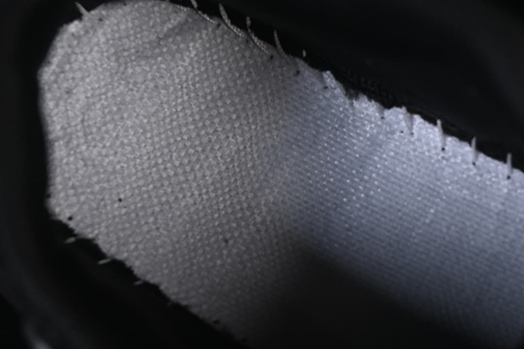 Close-up of the textured interior lining and stitching.