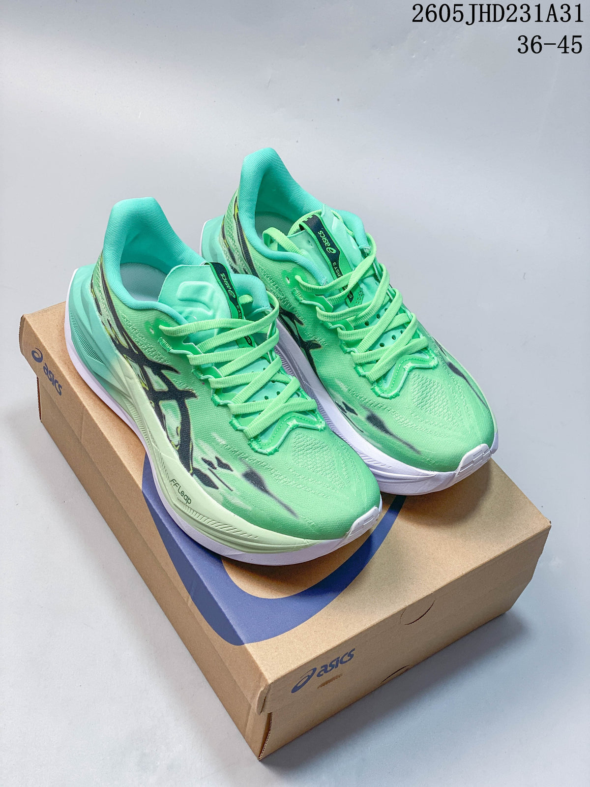Pair of bright green ASICS MEGABLAST lace-up running shoes displayed on a shoebox