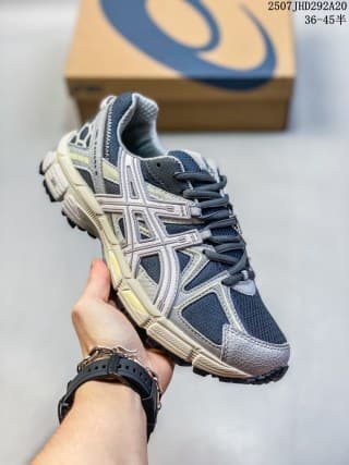 Three-quarter side view of the navy, gray, and white ASICS Gel-Kahana 8 sneaker.