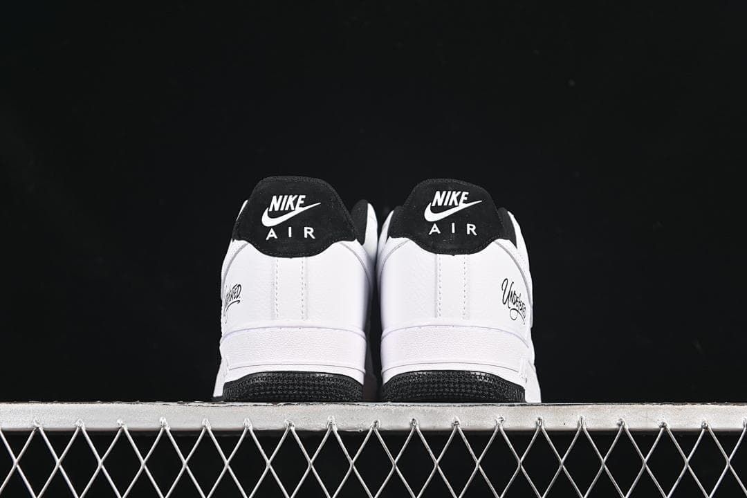 Rear view of the pair showing black heel tabs and Undefeated side details