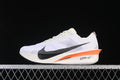 Nike ZoomX Vaporfly 4 road racing shoe in white with black Swoosh and orange midsole accent, side view