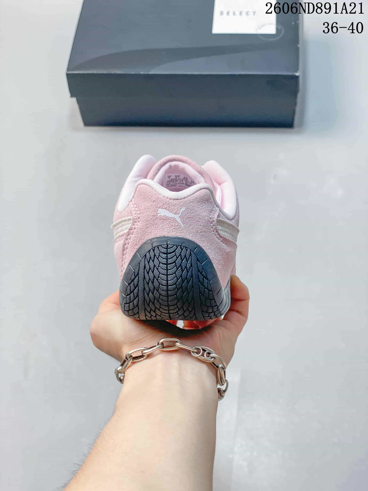 Rear view of a pink Puma Speedcat OG sneaker showing the heel and outsole