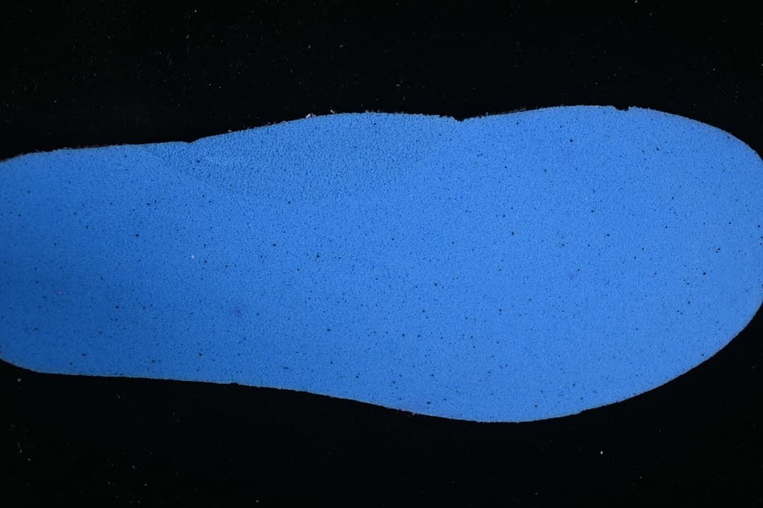 Blue shoe insole shown separately