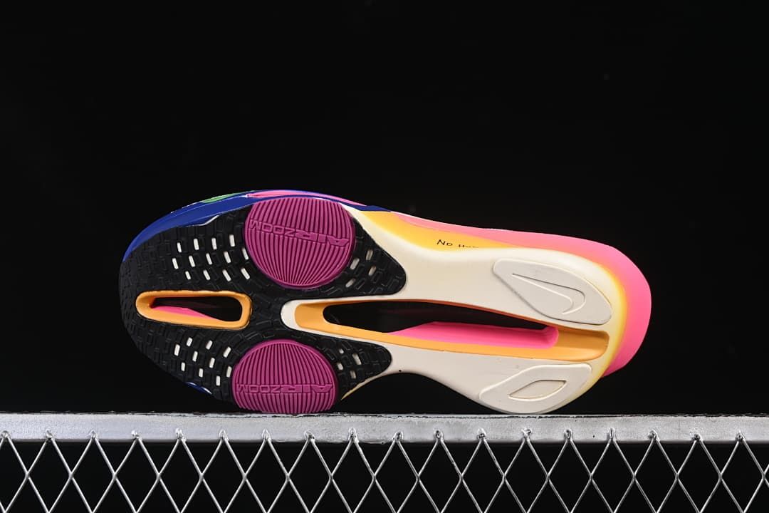 Underside view showing the patterned outsole and colored sole sections