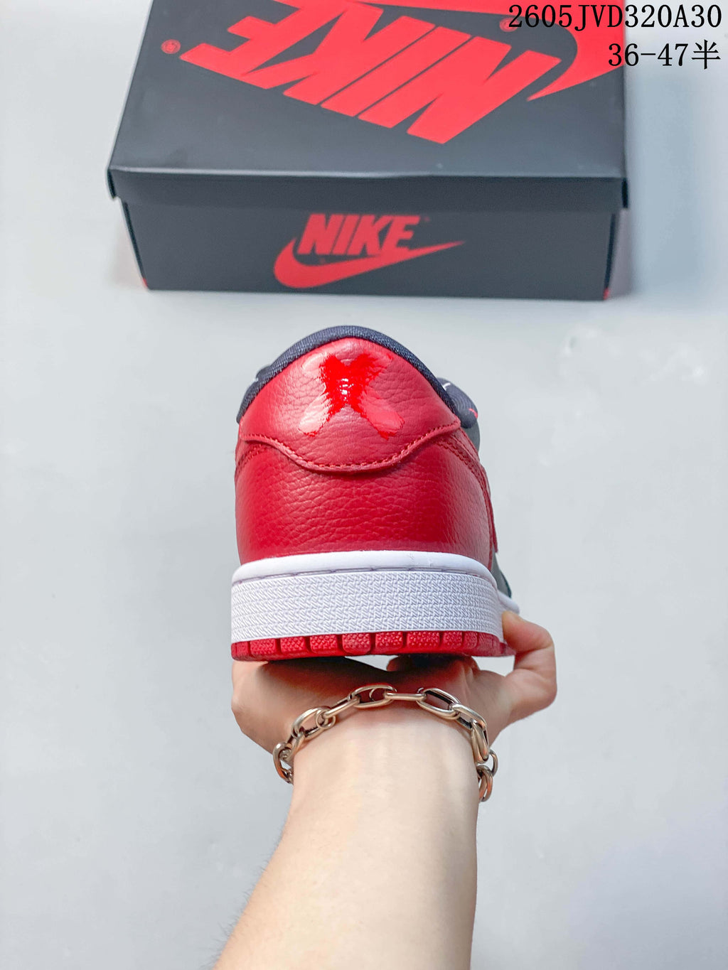 Rear view showing the red heel and white midsole