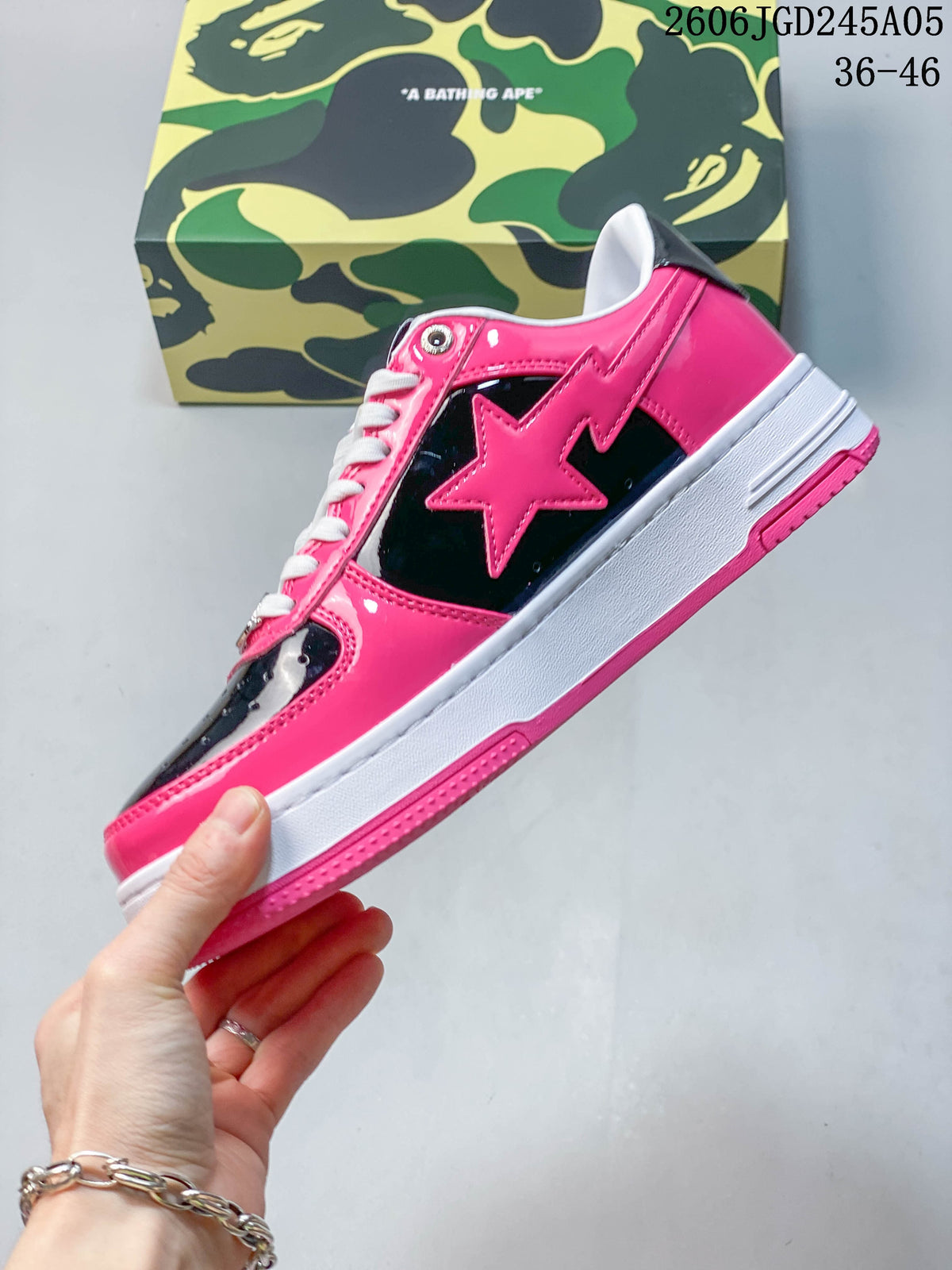 Side profile showing the pink star motif, black panels and contrasting sole
