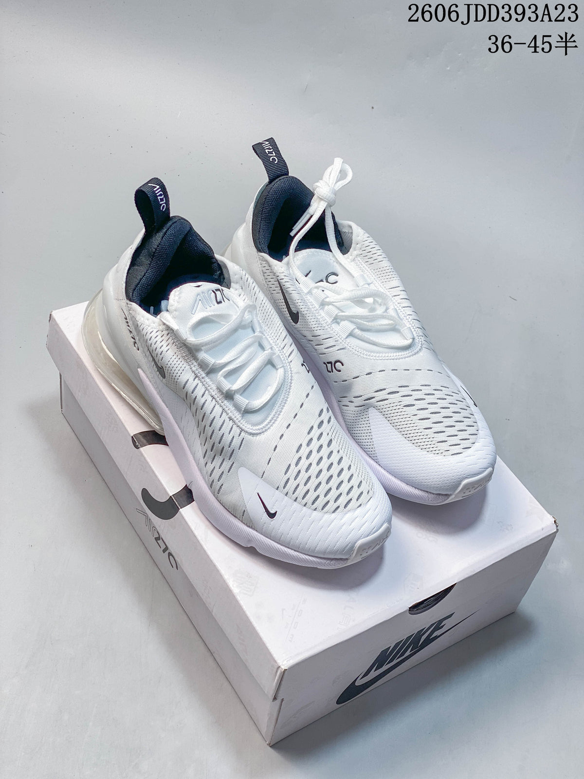 Pair of white Nike Air Max 270 sneakers on a shoebox