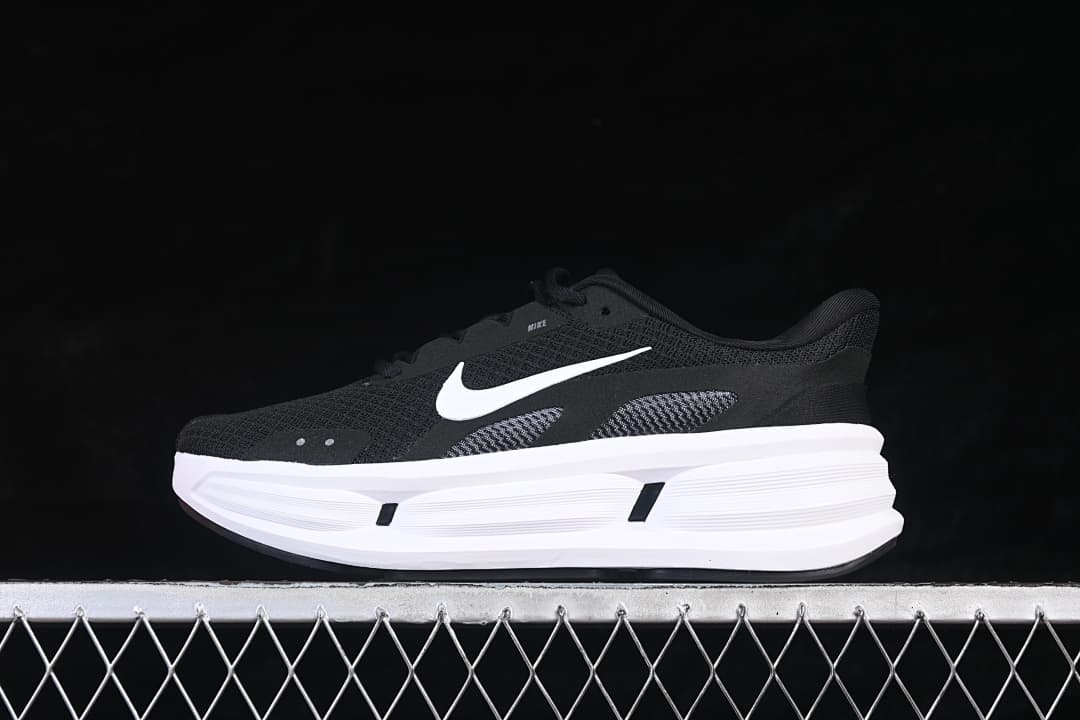 Side view of the Nike Comfort Ride Easyon in black and white, showing the opposite side.