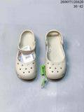 Pair of cream Crocs-style clogs viewed from above, showing perforated toes and heel straps.