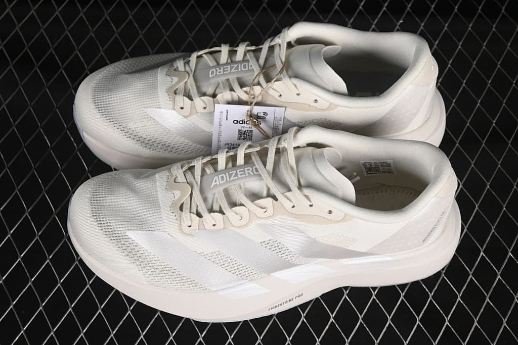 Pair of off-white Adizero Evo SL shoes shown from above and the side
