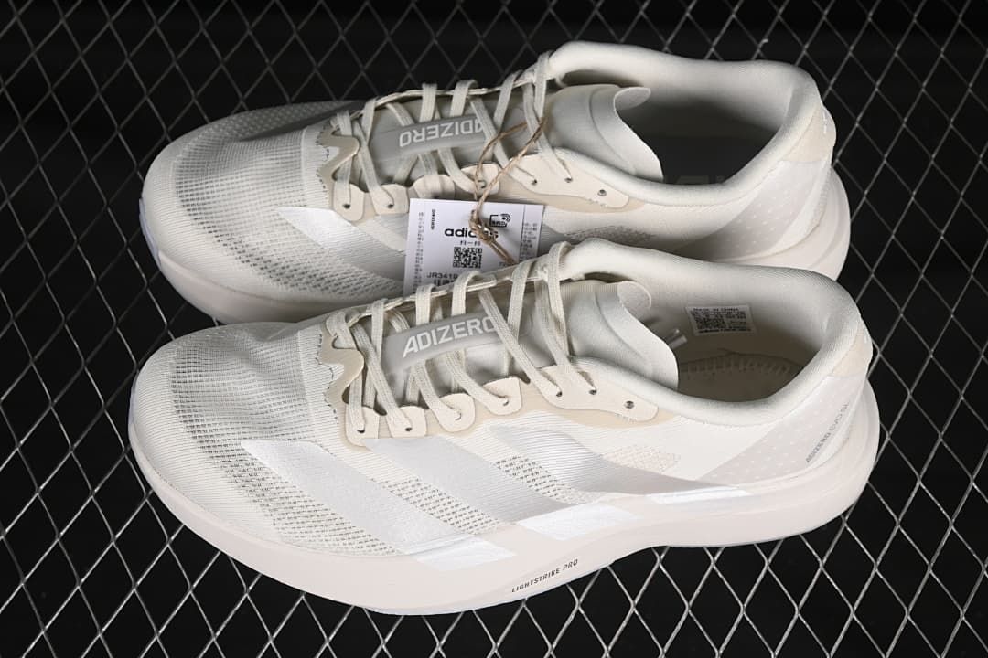 Pair of off-white Adizero Evo SL shoes shown from above and the side