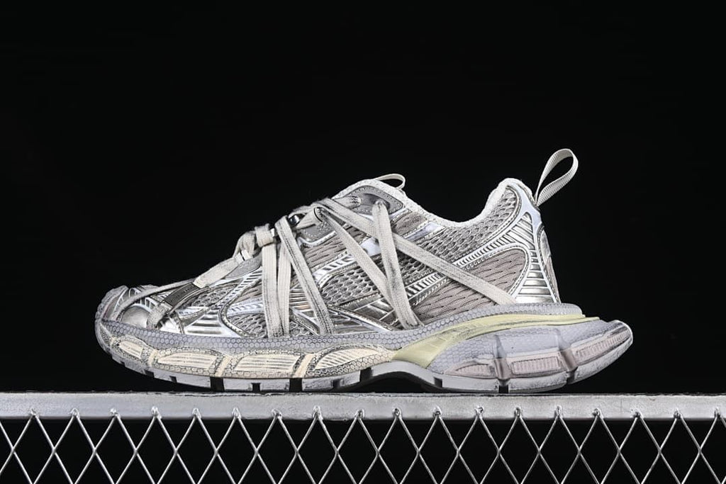 Side view of a silver and grey Balenciaga 3XL sneaker