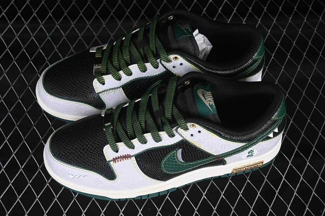 Overhead view of a pair of black, white, and green low-top Nike SB Dunk shoes