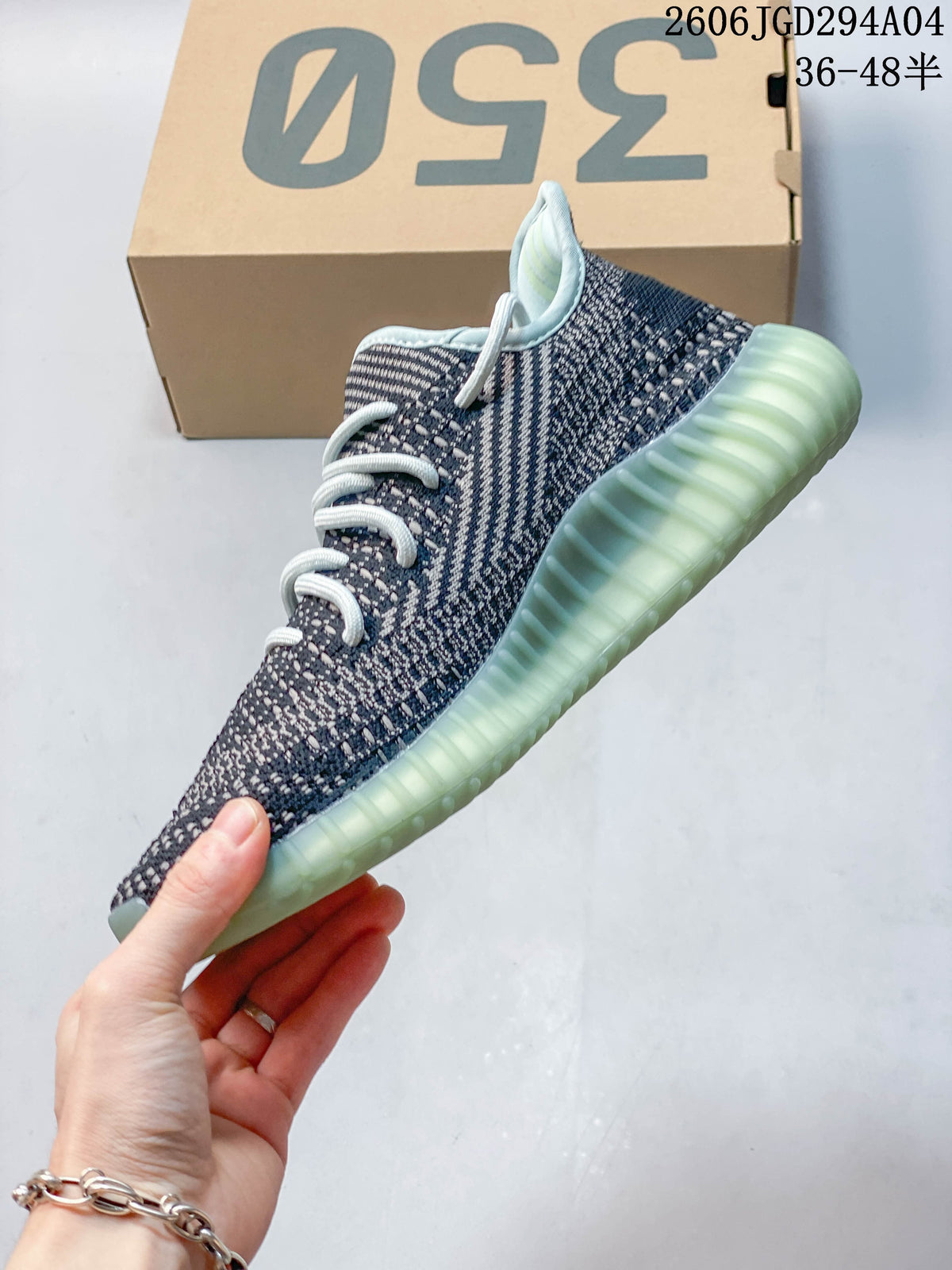 Side profile of the blue-gray knit-look sneaker with pale aqua ribbed sole