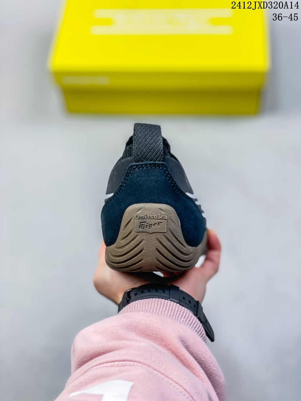 Rear view of a navy SCLAW sneaker showing its pull tab and textured heel section.