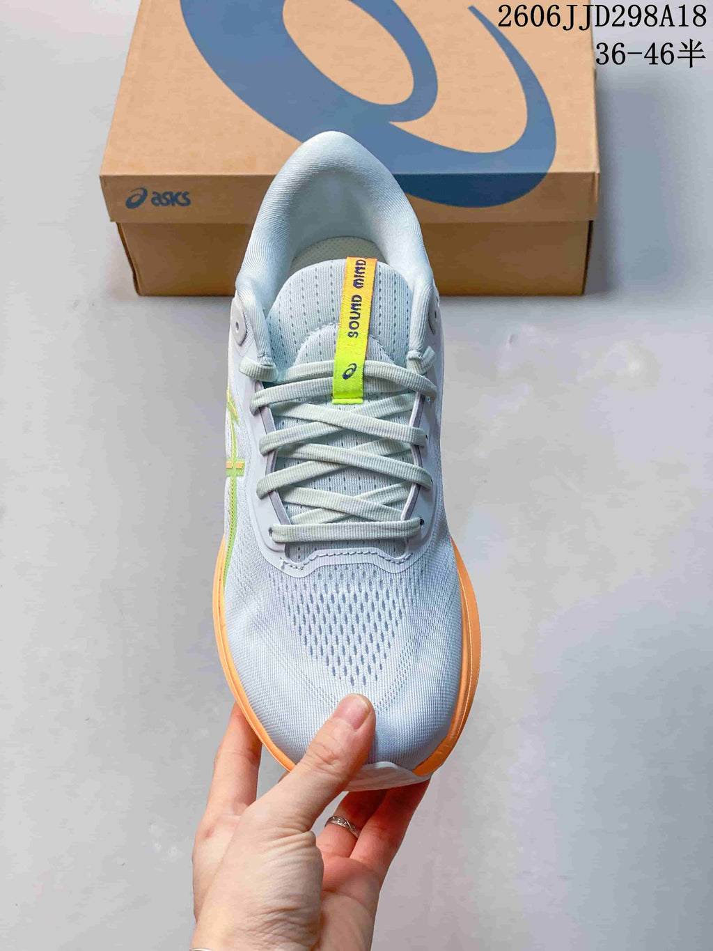 Top view of the running shoe showing its mesh-like toe area and laces