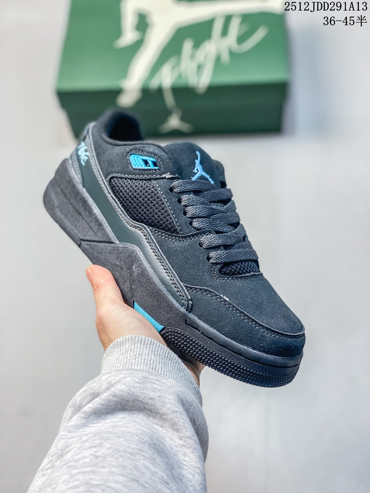 Angled side view of the dark low-top sneaker with blue accents