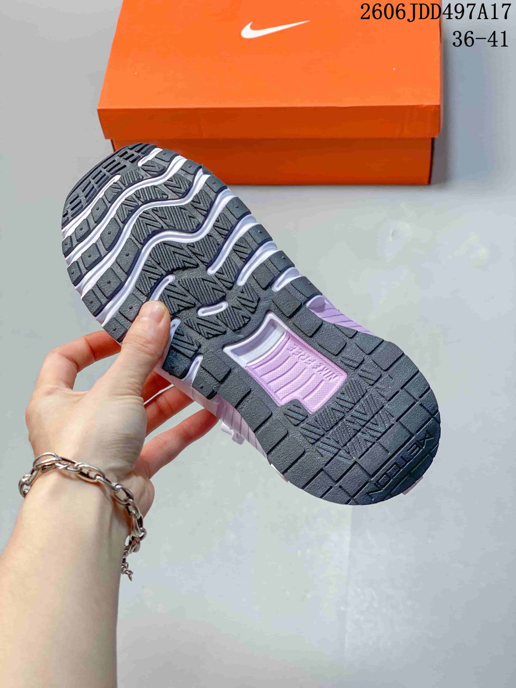 Close-up of the segmented outsole on a lavender training shoe