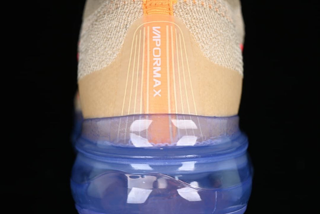 Rear view showing the VaporMax heel detail and translucent blue sole.