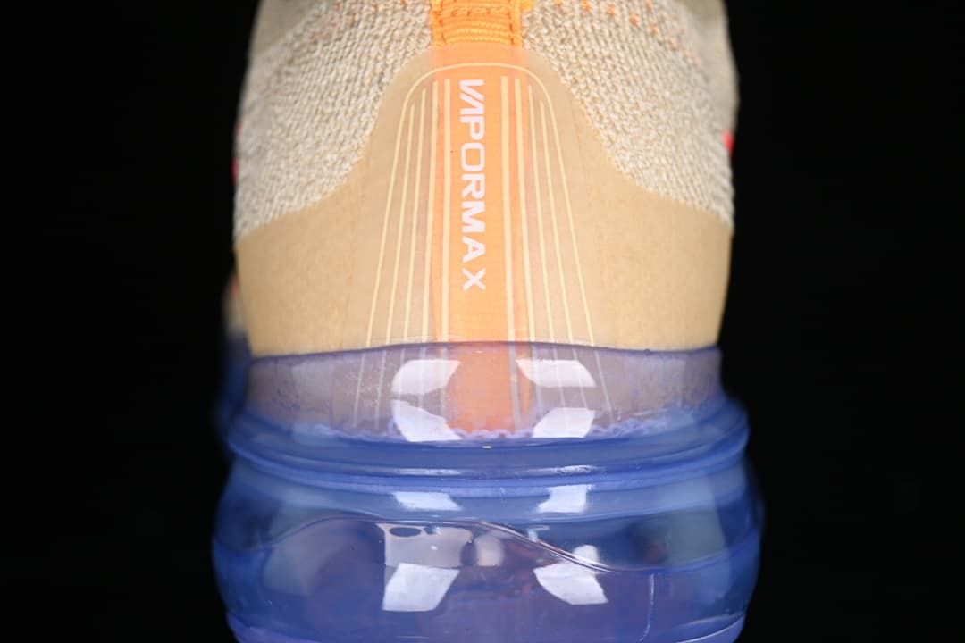 Rear view showing the VaporMax heel detail and translucent blue sole.