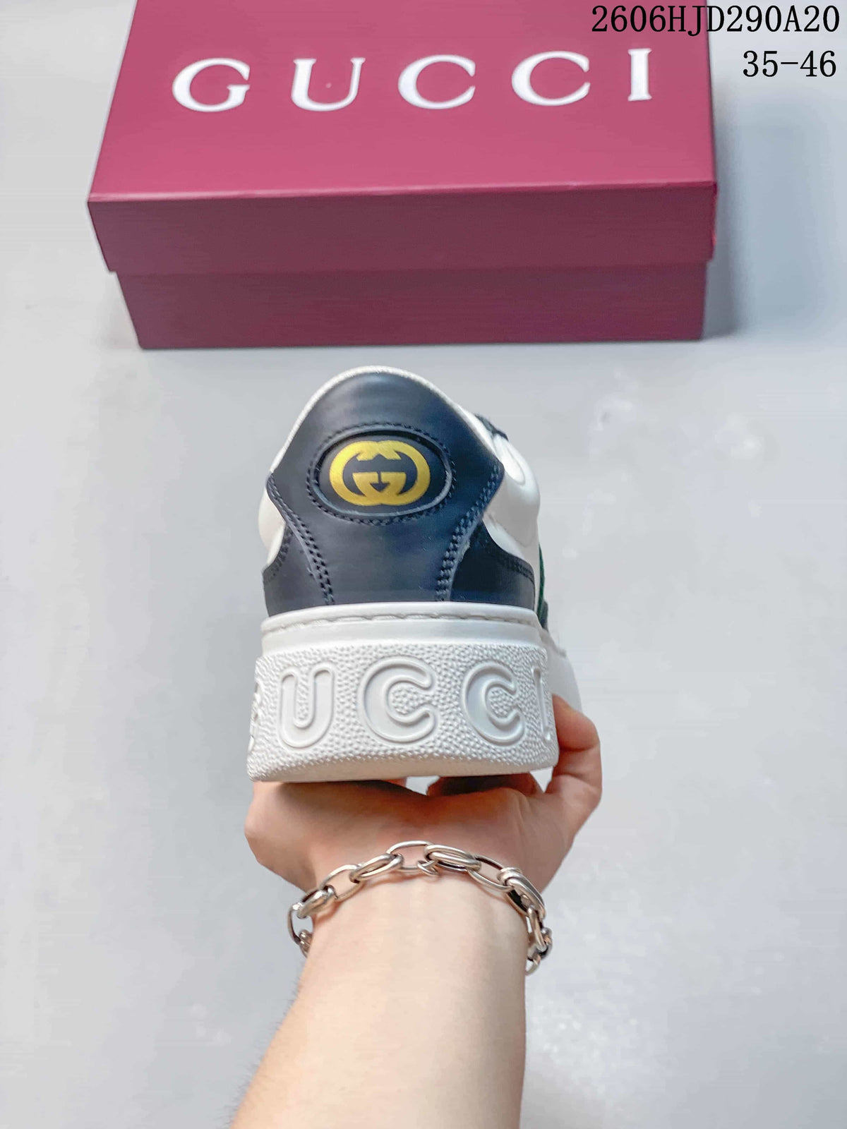 Rear view showing the navy heel panel and chunky white sole