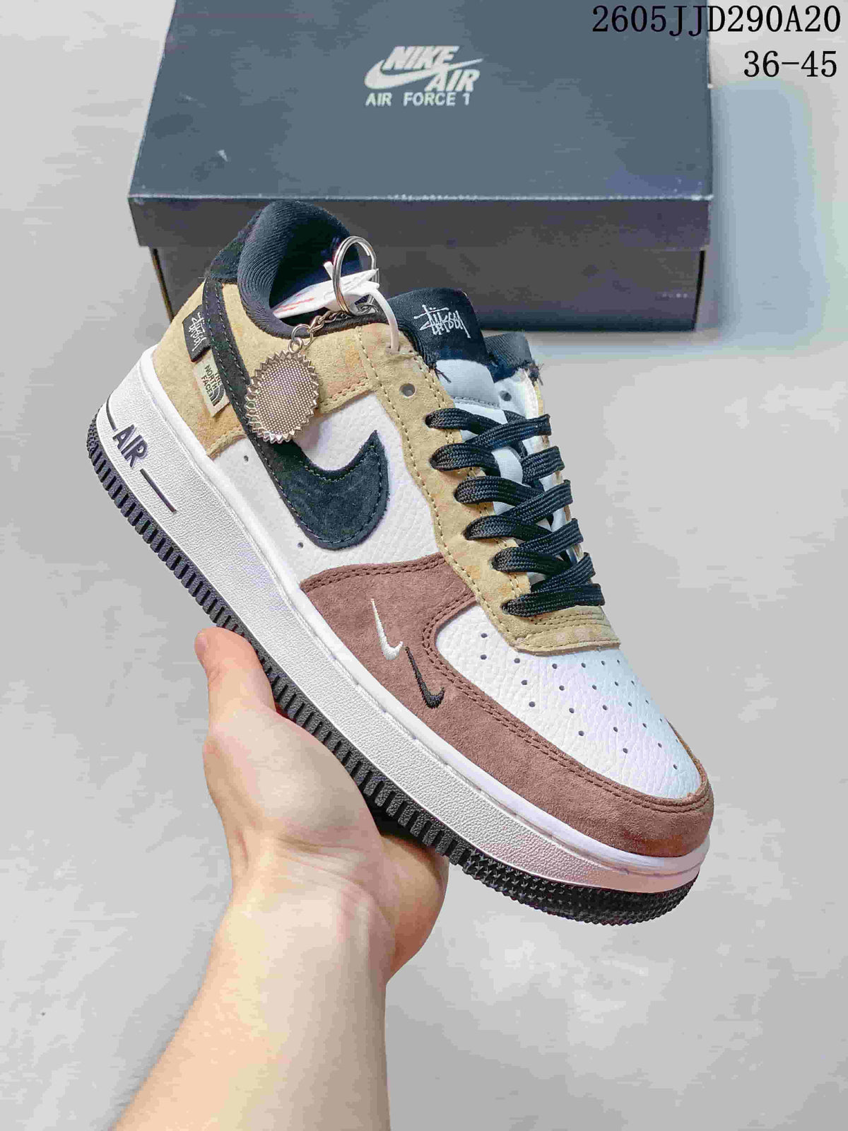 Angled view of the multicolor sneaker with a decorative charm near the laces