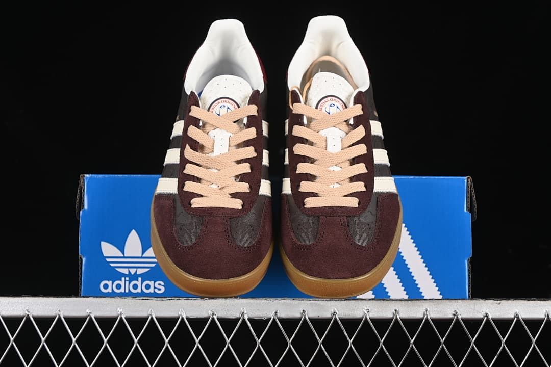 Front view of the pair displayed on a blue adidas box.