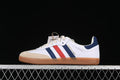 Side view of the white adidas Samba OG Sporty & Rich with navy and red stripes, a sand-colored toe overlay, and gum-colored sole