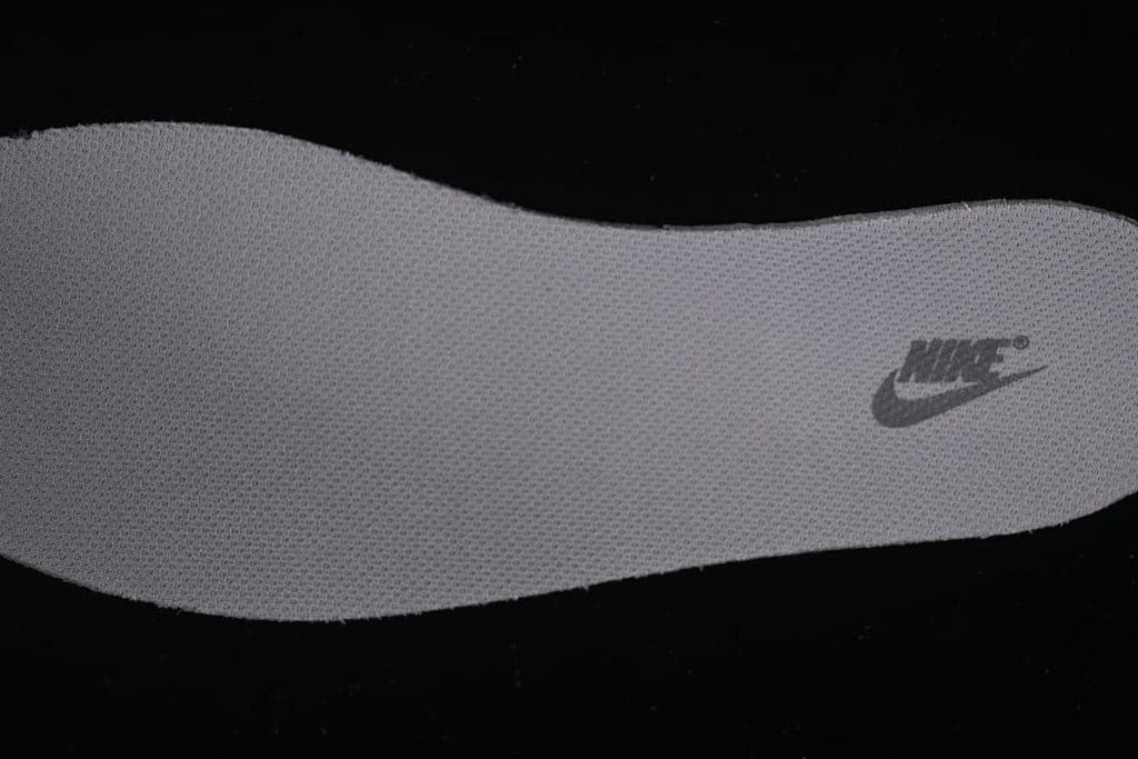 Close-up view of a textured shoe insert with Nike branding
