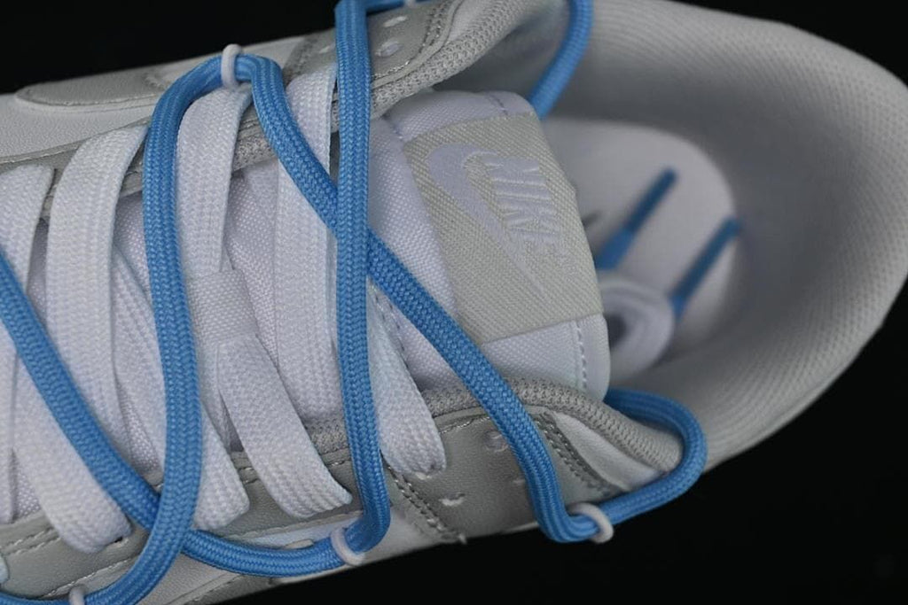 Close-up of the tongue and layered blue and white laces
