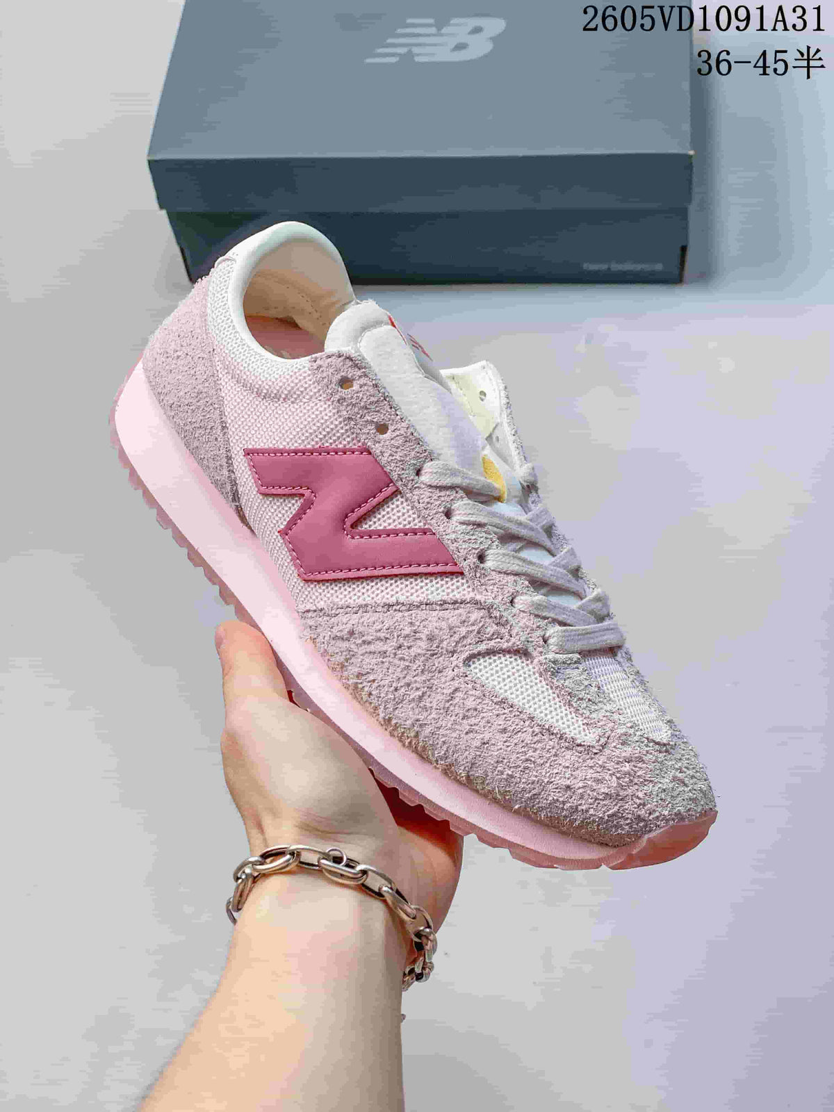 Angled side view of a pale pink New Balance 471 sneaker with darker pink branding.