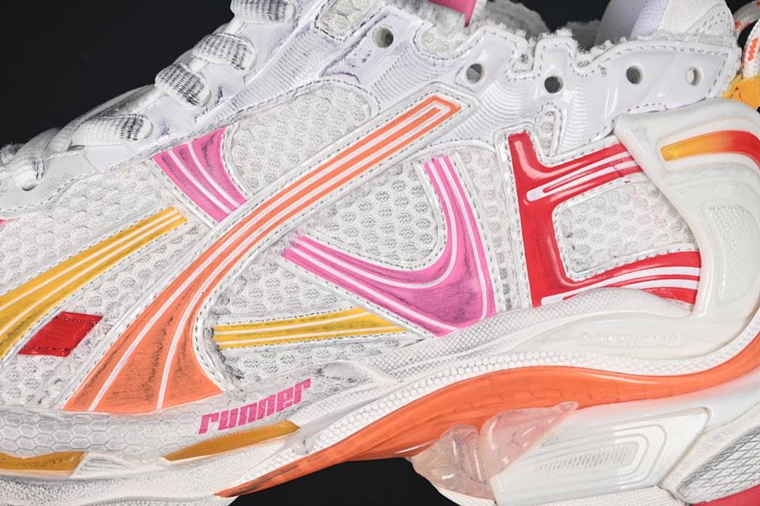 Close-up of mesh-look panels and multicolor side overlays