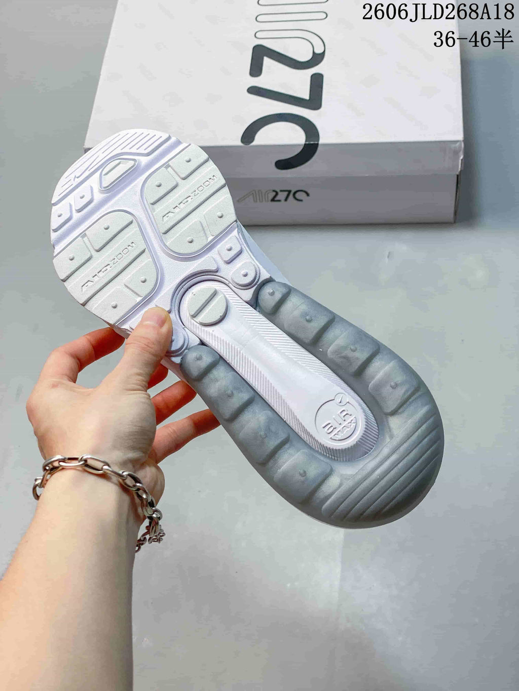 Outsole of a white Nike Air Max Pulse shoe showing tread and heel unit
