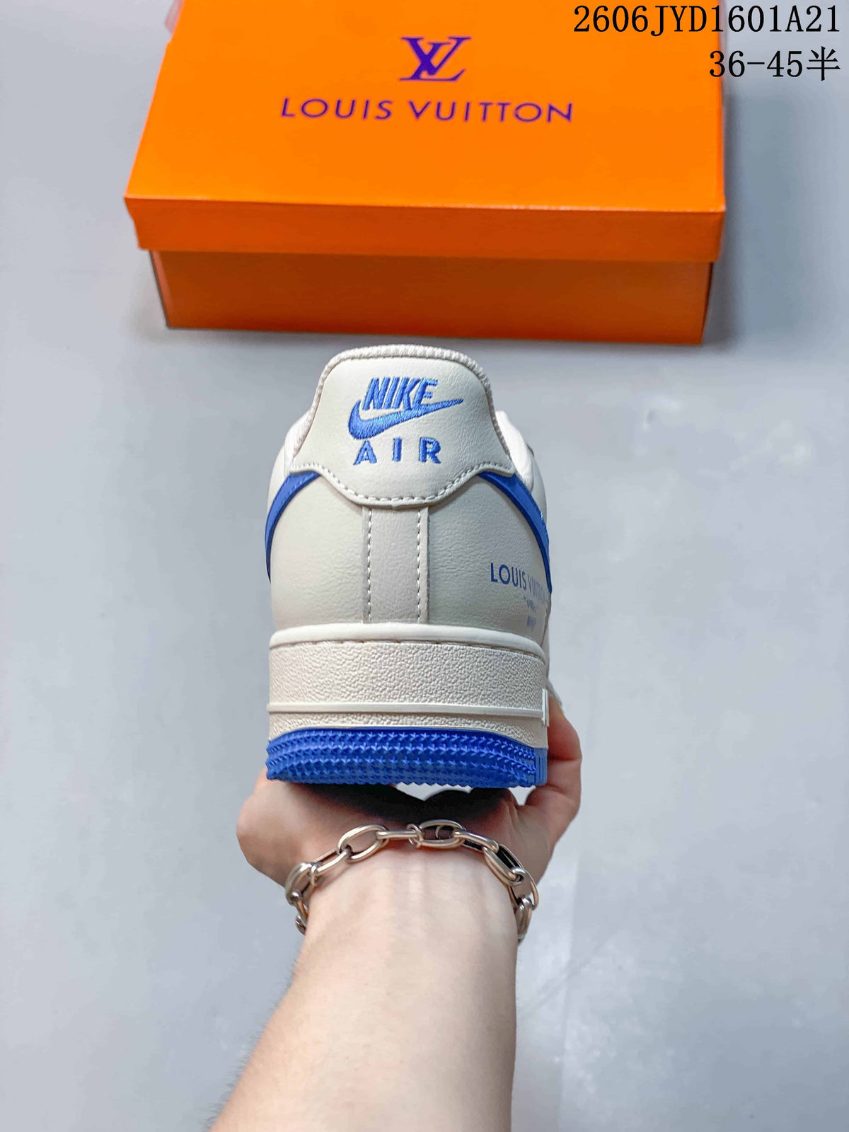Rear view showing blue heel details on a white sneaker