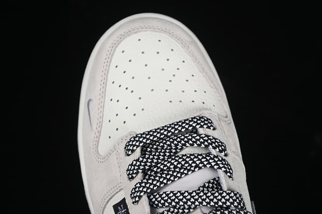 Top view of the perforated toe and patterned laces