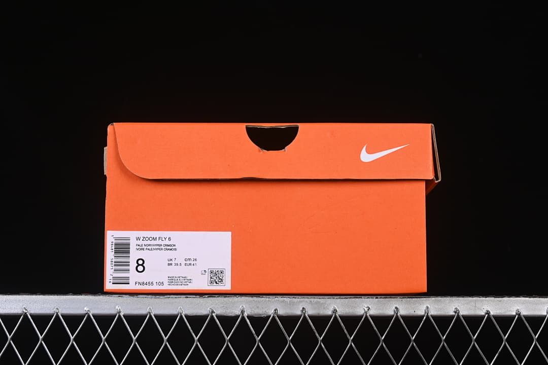Orange shoe box label identifying a women's Zoom Fly 6 and displaying sample sizing.