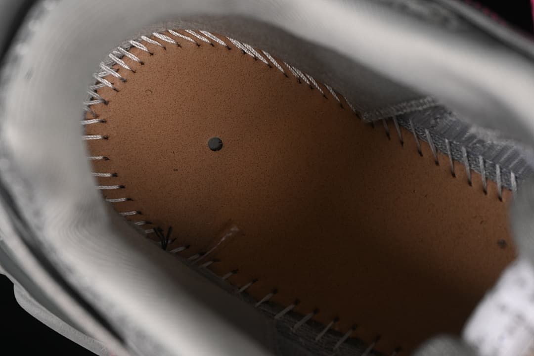 Close-up inside the sneaker showing the footbed and stitching