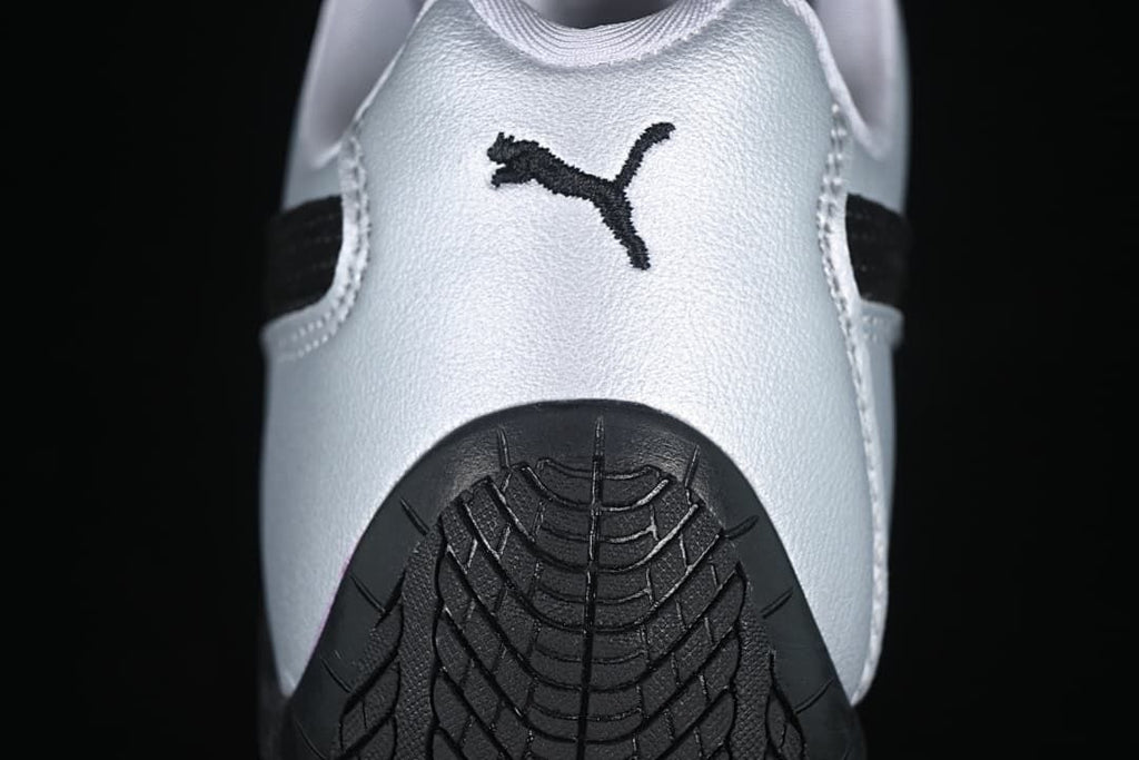 Rear view showing Puma branding and the patterned black heel outsole.