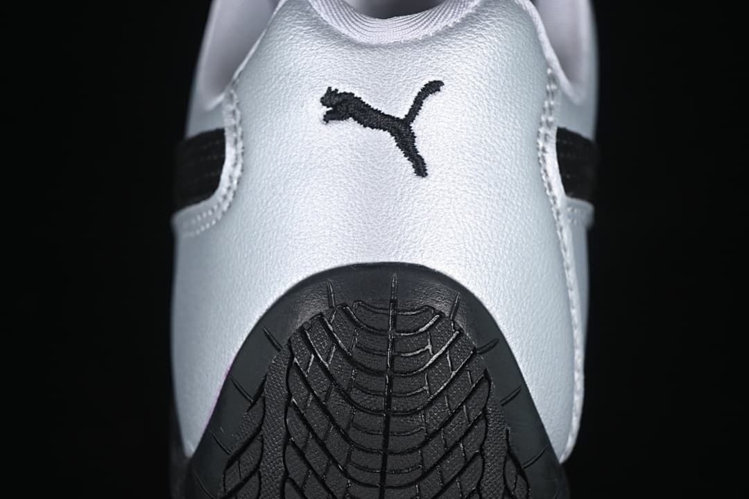 Rear view showing Puma branding and the patterned black heel outsole.