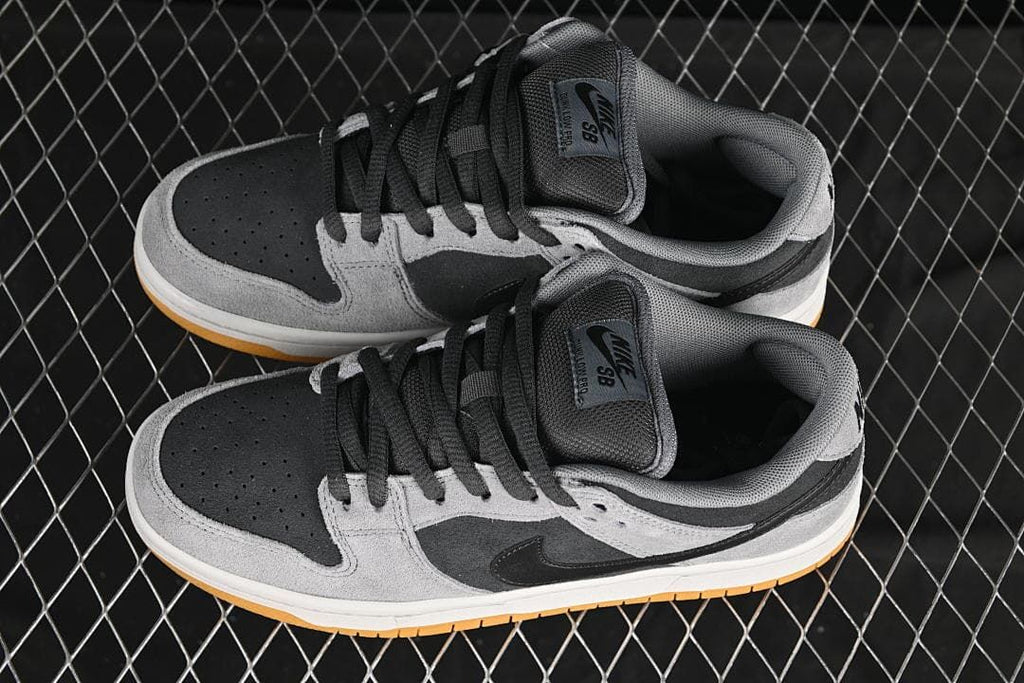Pair of grey and black low-top sneakers shown from above