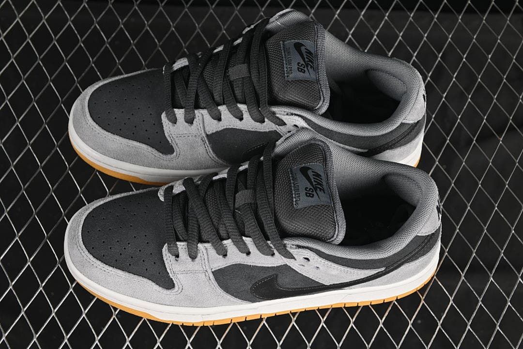 Pair of grey and black low-top sneakers shown from above