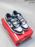 Pair of black, white, and gray Nike Dunk Low Retro sneakers on a red shoe box