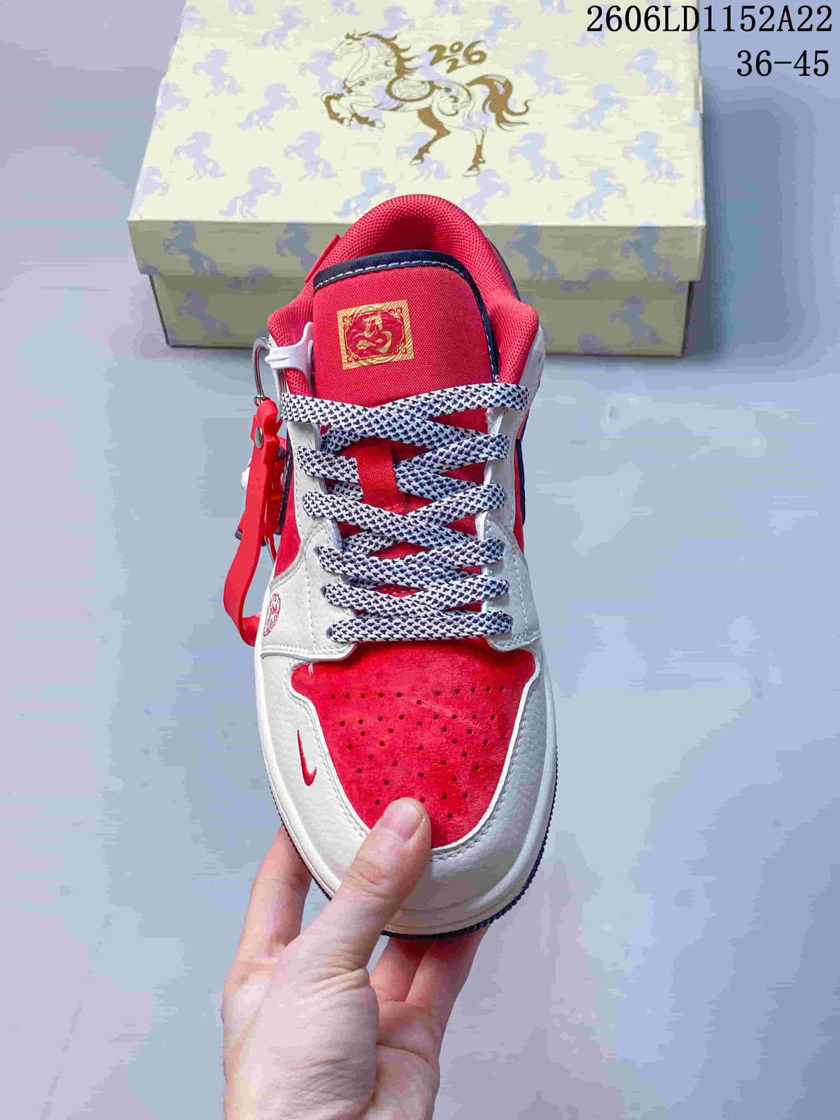 Front view showing the perforated red toe and patterned laces