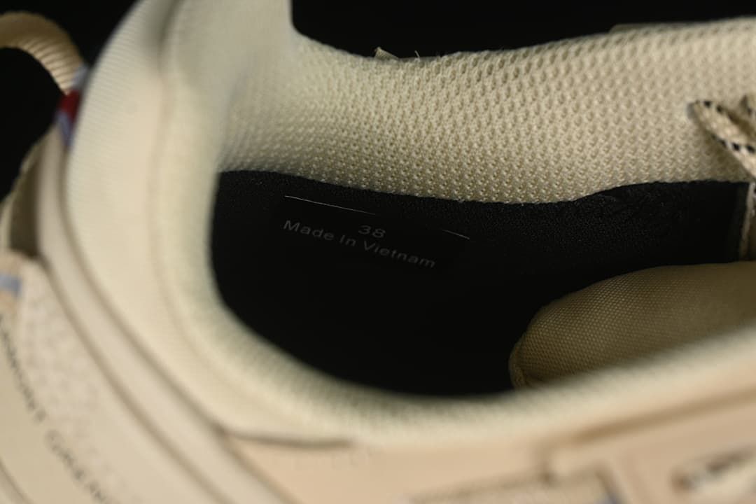 Interior marking on the shoe reads EU 38 and Made in Vietnam.