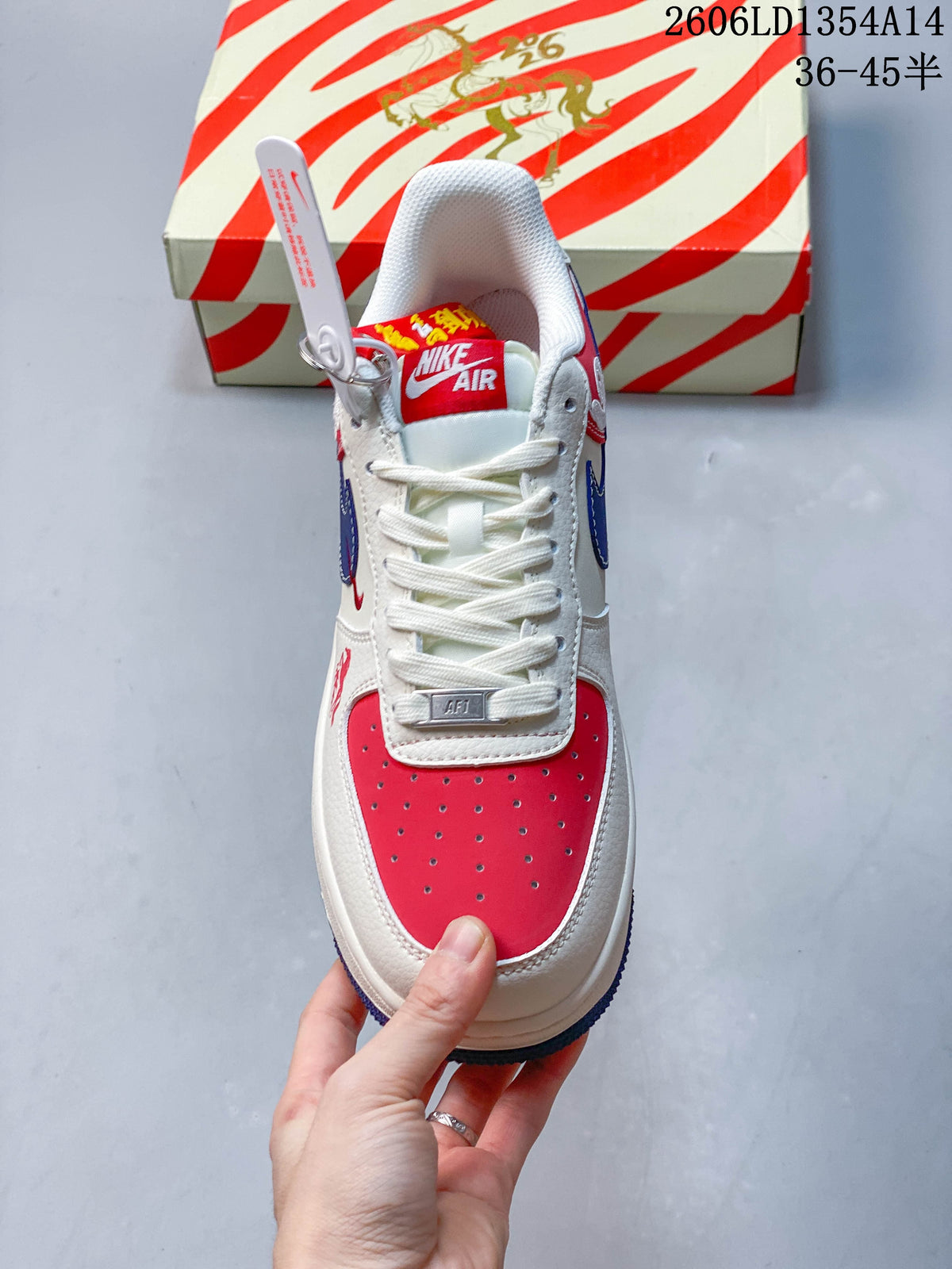 Top view showing white laces and a perforated red toe panel.